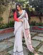 Elegant White Pure Linen Digital Printed Saree with Chevron Design and Intricate Red-Black Geometric Pallu ā Tassel Details and Matching Blouse Piece