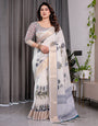 White Handloom Linen Saree with Grey Rose Floral Print & Gold Zari Border | Striped Pallu & Tassel Detailing | Attached Blouse | 5.5m Saree + 0.8m Blouse
