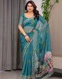 Teal Green Scenic Printed Organza Saree with Garden Pavilion Artwork Pallu | Designer Lightweight Organza Saree with Floral Motifs & Decorative Border | Festive & Party Wear Saree with Blouse Piece