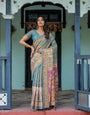 Turquoise Blue Handloom Cotton Saree with Multicolor Floral Pallu & Peach Border