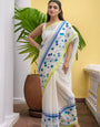 Ivory Mul Cotton Saree with Blue Floral Embroidery, Contrast Border & Tasselled Pallu, Comes With Attached Blouse Piece