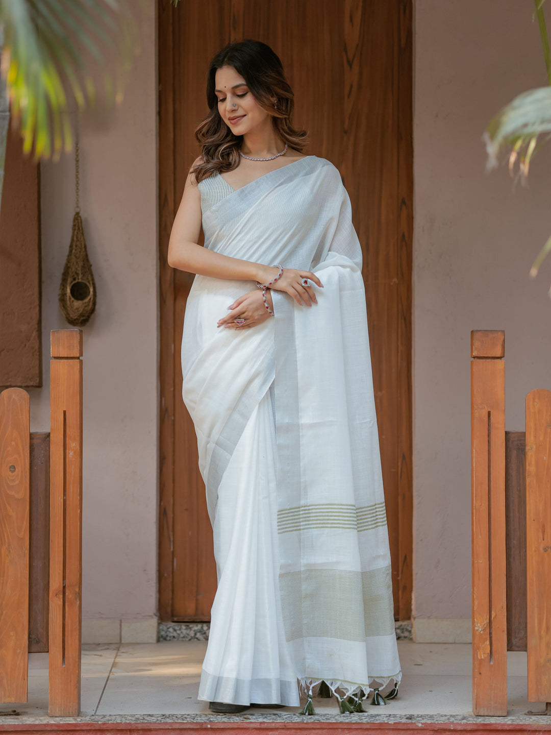 Pure White & Olive Green Handloom Cotton Saree with Minimal Striped Border & Tassel Detailing