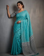 Aqua Blue Mul Cotton Saree with Aari Foil Mirror Work, Embroidered Arco Border & Contrast Printed Pallu with Blouse Piece