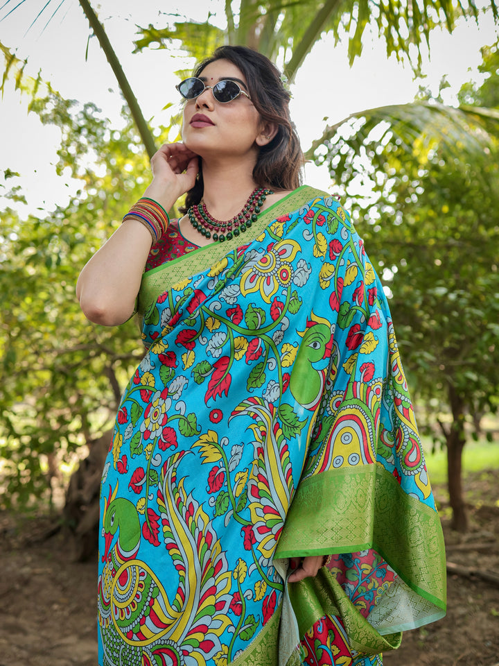 Turquoise Blue Tussar Silk Saree with Kalamkari Peacock Print, Green Woven Border, Tassels & Attached Blouse