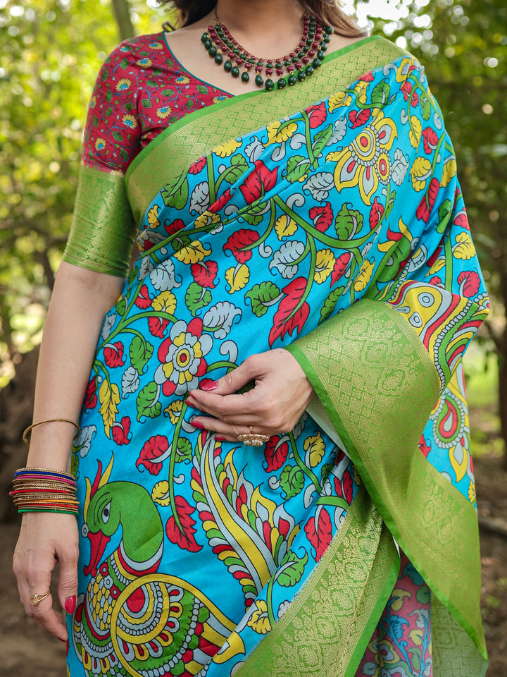 Turquoise Blue Tussar Silk Saree with Kalamkari Peacock Print, Green Woven Border, Tassels & Attached Blouse