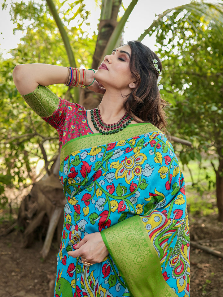 Turquoise Blue Tussar Silk Saree with Kalamkari Peacock Print, Green Woven Border, Tassels & Attached Blouse