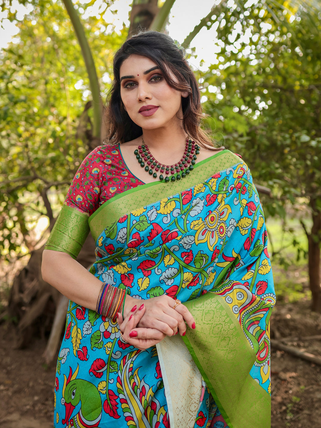 Turquoise Blue Tussar Silk Saree with Kalamkari Peacock Print, Green Woven Border, Tassels & Attached Blouse