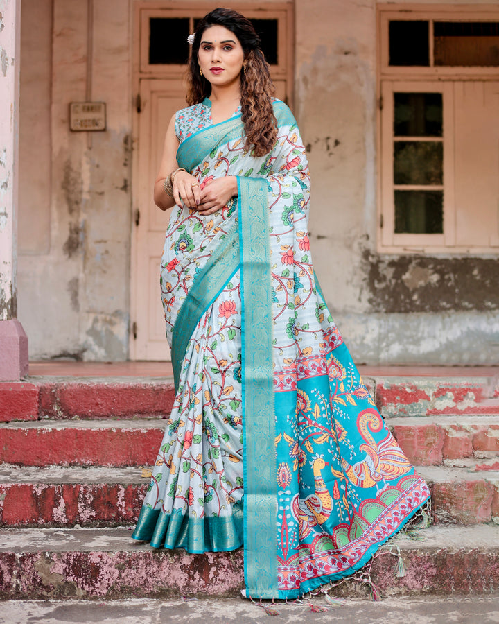 Ice Blue Tussar Silk Saree with Kalamkari Floral Print, Turquoise Woven Border, Peacock Pallu, Tassels & Attached Blouse
