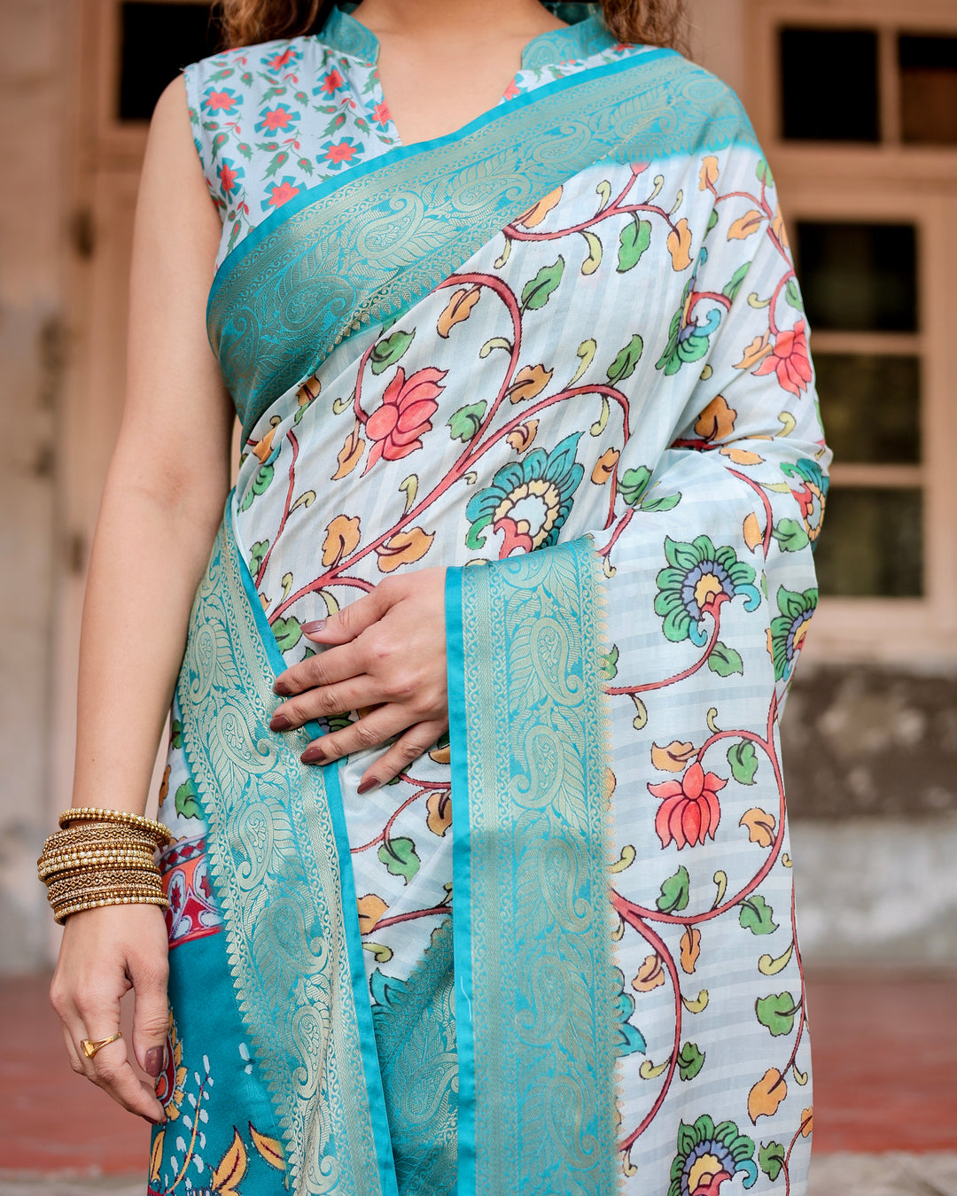 Ice Blue Tussar Silk Saree with Kalamkari Floral Print, Turquoise Woven Border, Peacock Pallu, Tassels & Attached Blouse