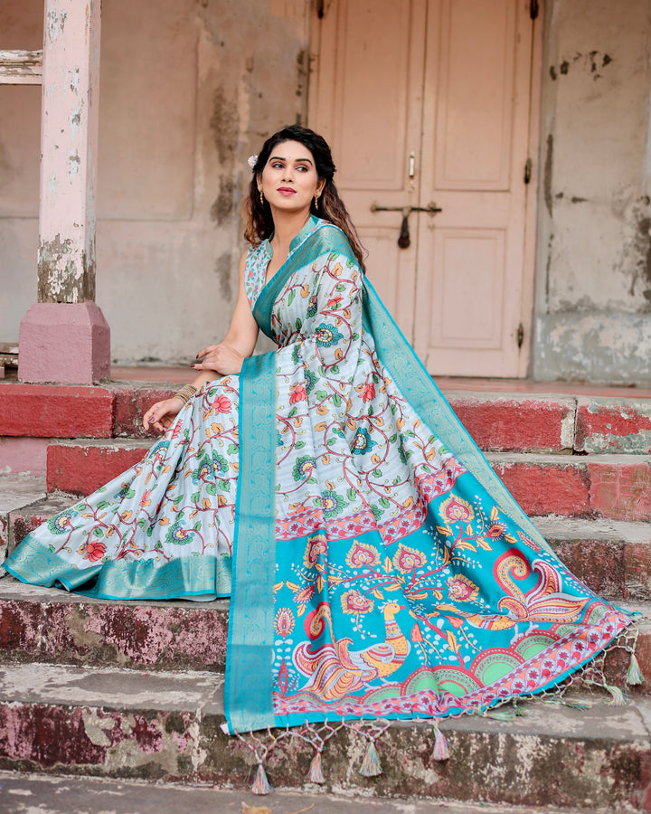 Ice Blue Tussar Silk Saree with Kalamkari Floral Print, Turquoise Woven Border, Peacock Pallu, Tassels & Attached Blouse