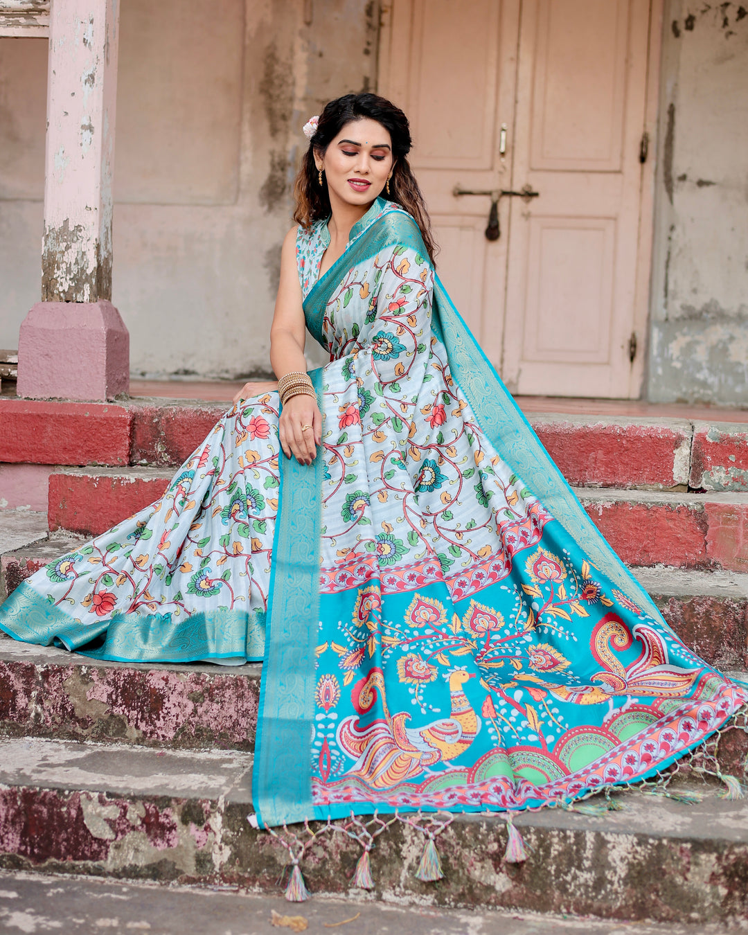 Ice Blue Tussar Silk Saree with Kalamkari Floral Print, Turquoise Woven Border, Peacock Pallu, Tassels & Attached Blouse