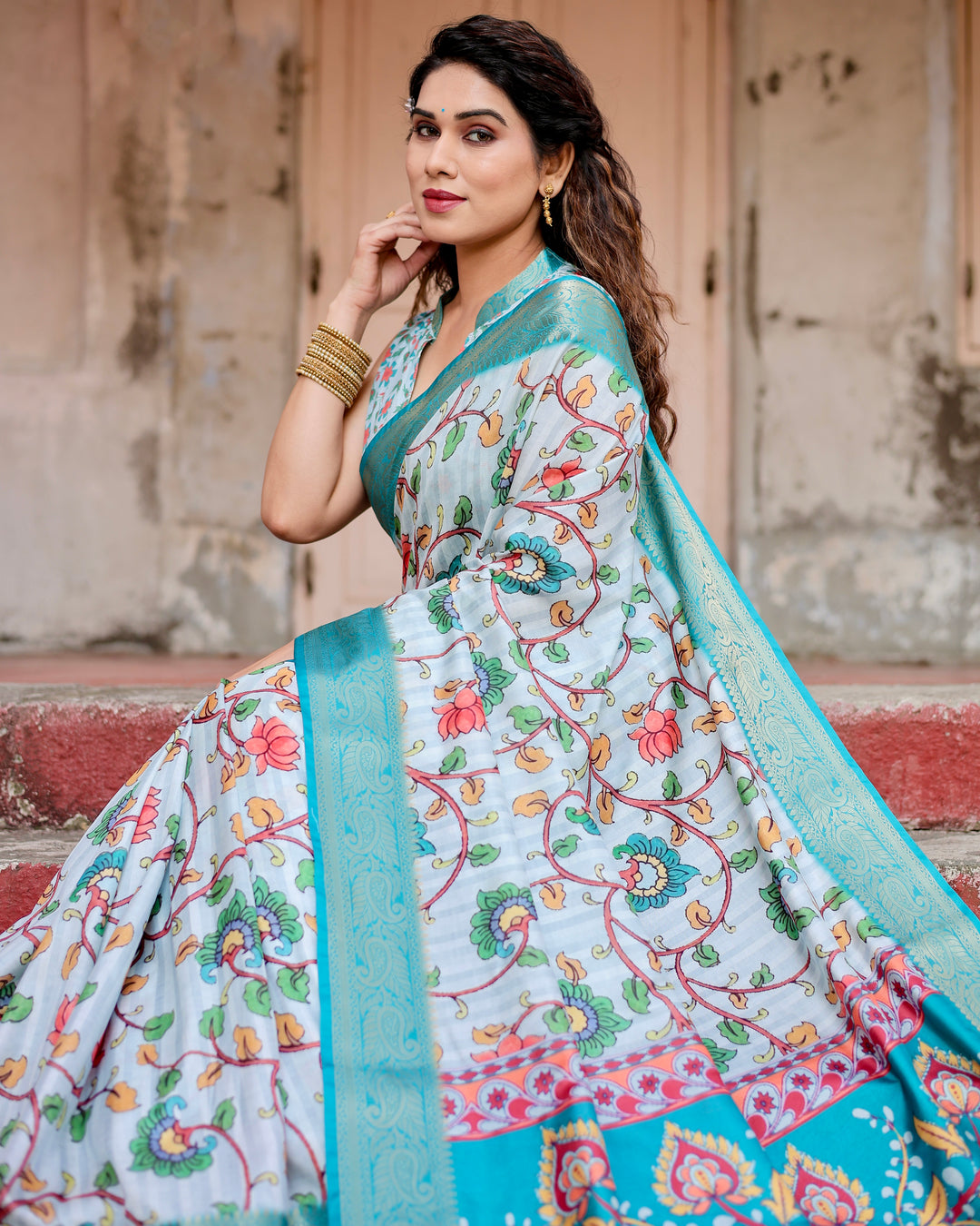 Ice Blue Tussar Silk Saree with Kalamkari Floral Print, Turquoise Woven Border, Peacock Pallu, Tassels & Attached Blouse