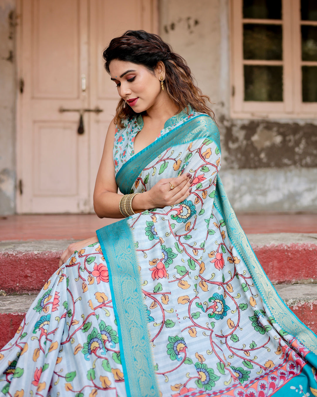 Ice Blue Tussar Silk Saree with Kalamkari Floral Print, Turquoise Woven Border, Peacock Pallu, Tassels & Attached Blouse