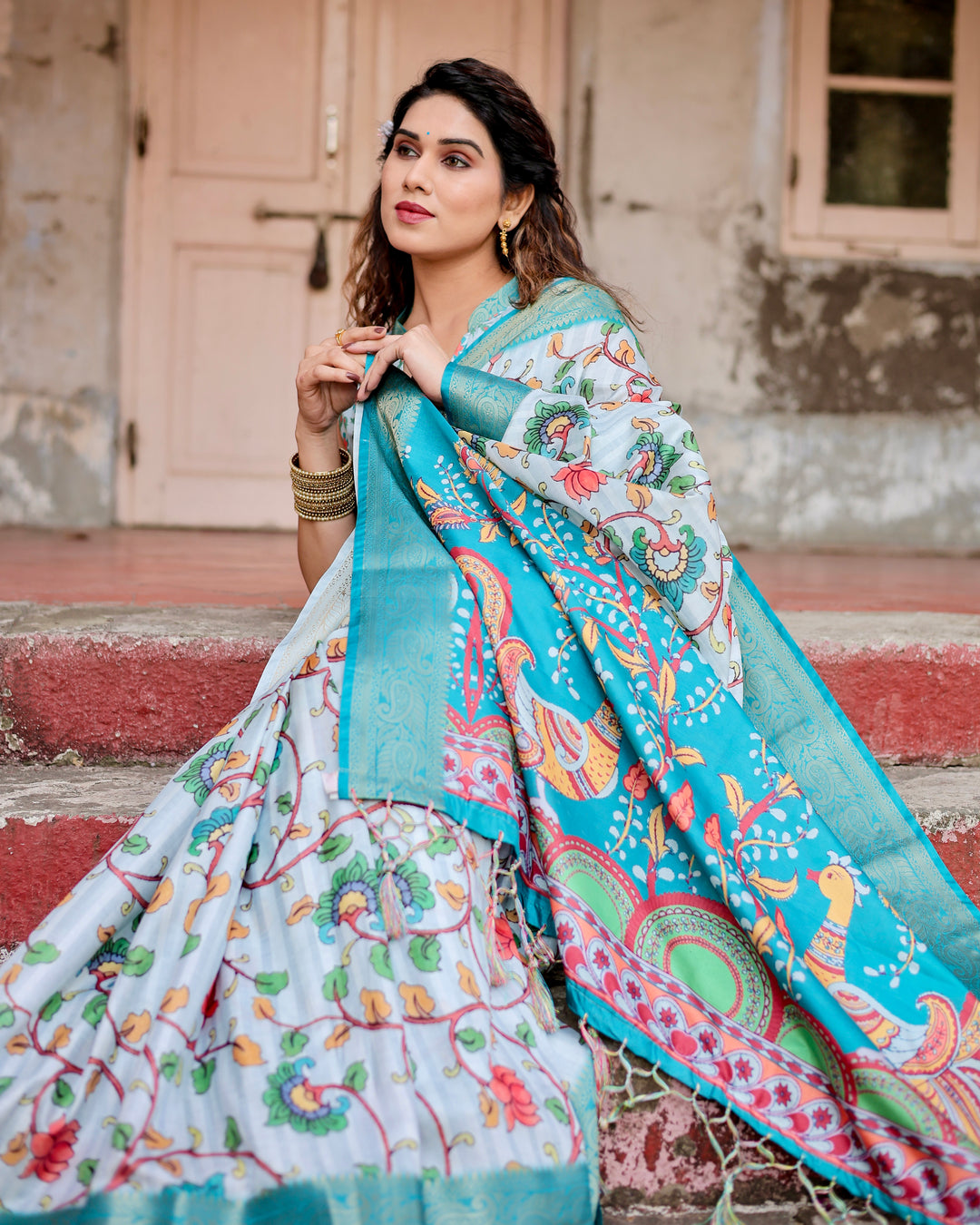 Ice Blue Tussar Silk Saree with Kalamkari Floral Print, Turquoise Woven Border, Peacock Pallu, Tassels & Attached Blouse