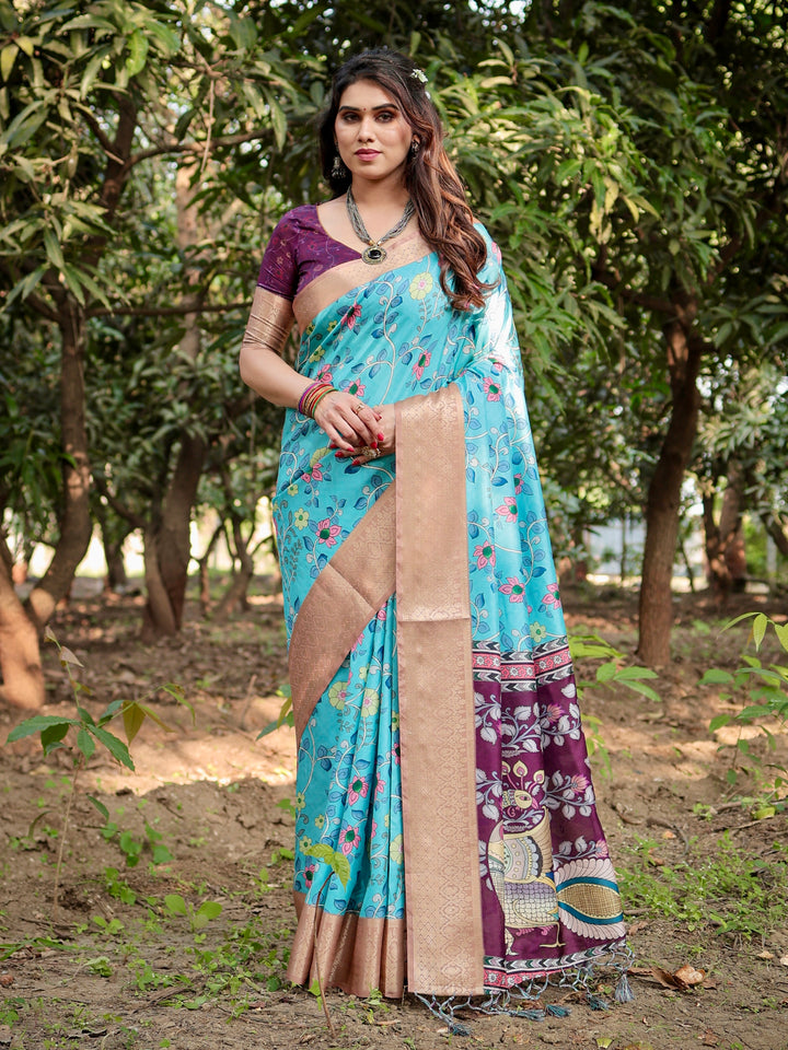 Aqua Blue Tussar Silk Saree with Floral Print, Peacock Pallu, Antique Gold Woven Border, Tassels & Attached Blouse