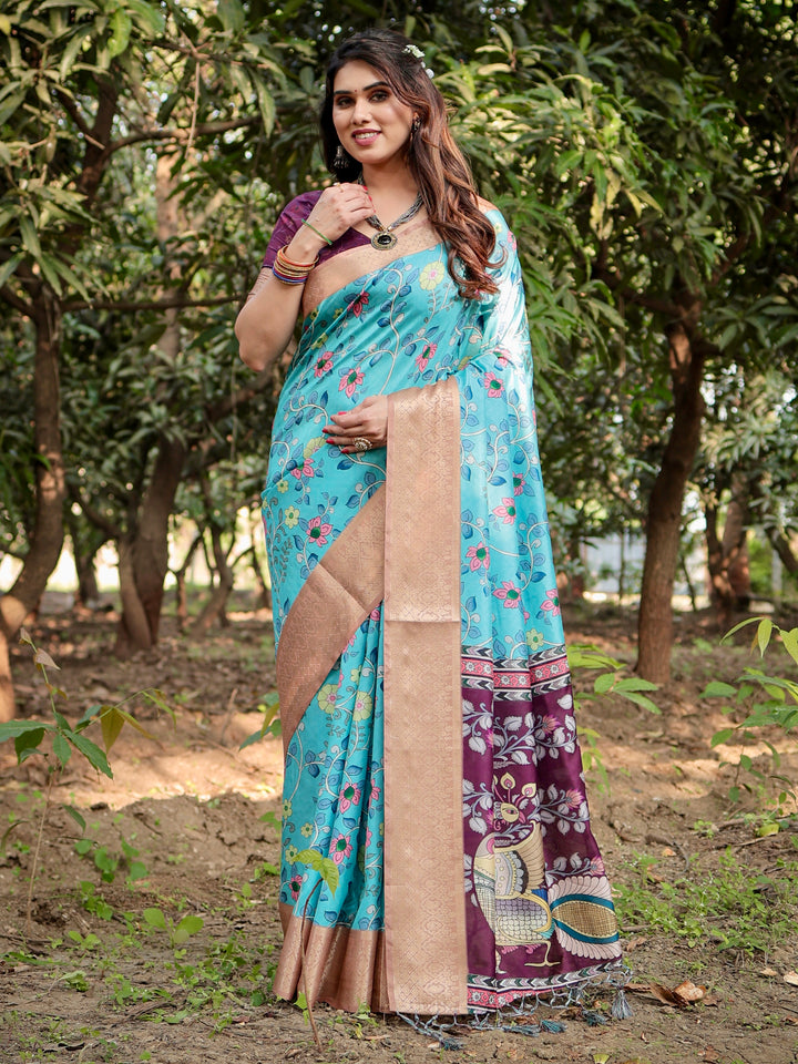 Aqua Blue Tussar Silk Saree with Floral Print, Peacock Pallu, Antique Gold Woven Border, Tassels & Attached Blouse