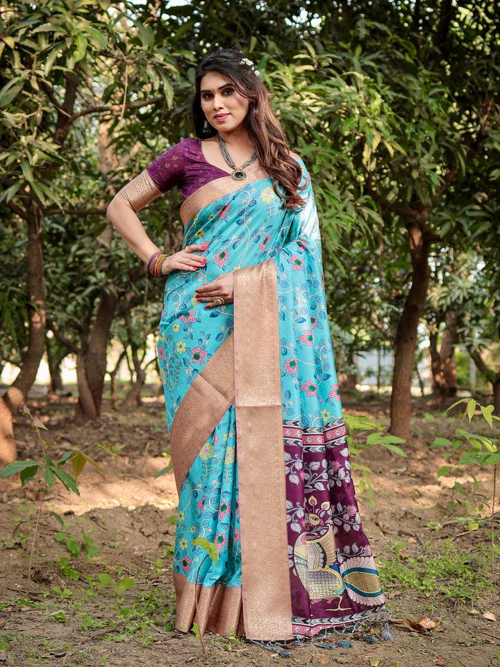Aqua Blue Tussar Silk Saree with Floral Print, Peacock Pallu, Antique Gold Woven Border, Tassels & Attached Blouse