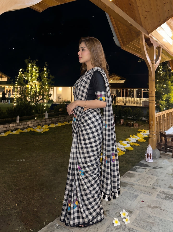 Black & White Checkered Mul Cotton Saree with Multicolour Floral Motifs, Tassels & Blouse Piece