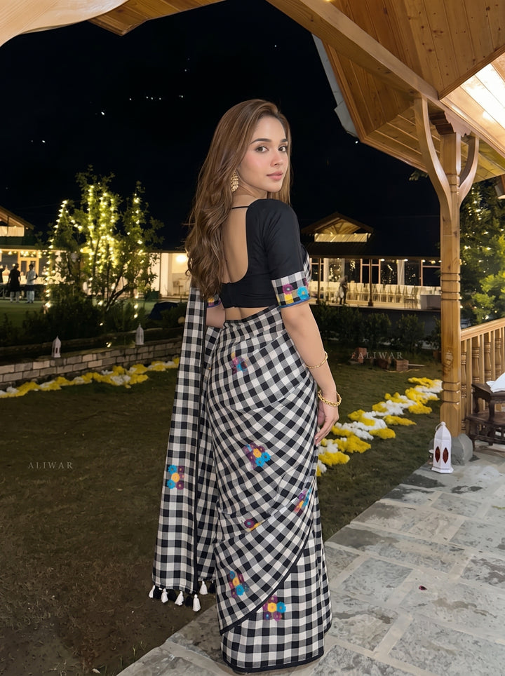 Black & White Checkered Mul Cotton Saree with Multicolour Floral Motifs, Tassels & Blouse Piece