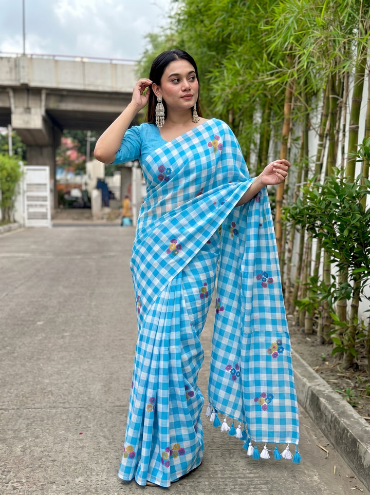Sky Blue & White Checkered Mul Cotton Saree with Multicolour Floral Motifs, Tassels & Blouse Piece