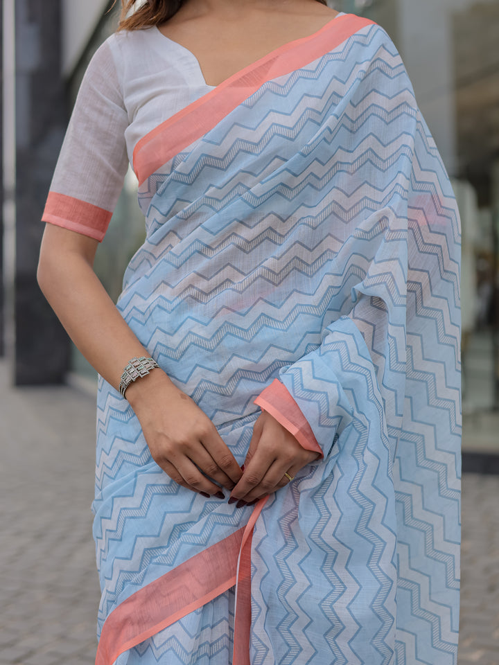 Powder Blue Mul Cotton Chevron Print Saree with Coral Border, Statement Pallu & Tassels | Office Wear Saree