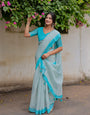Aqua Blue Mul Cotton Floral Print Saree with Contrast Border & Tassels | Elegant Office & Daily Wear Saree, Comes With Attached Blouse Piece