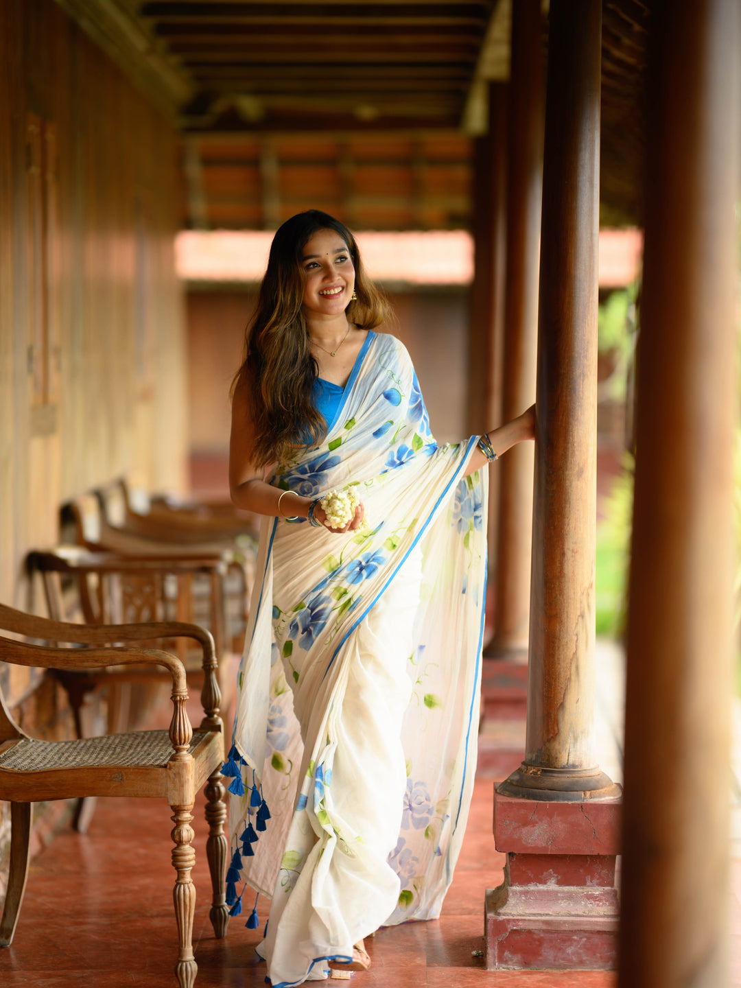 Ivory Chiffon Floral Printed Saree with Blue Rose Print, Contrast Border & Tassel Edges