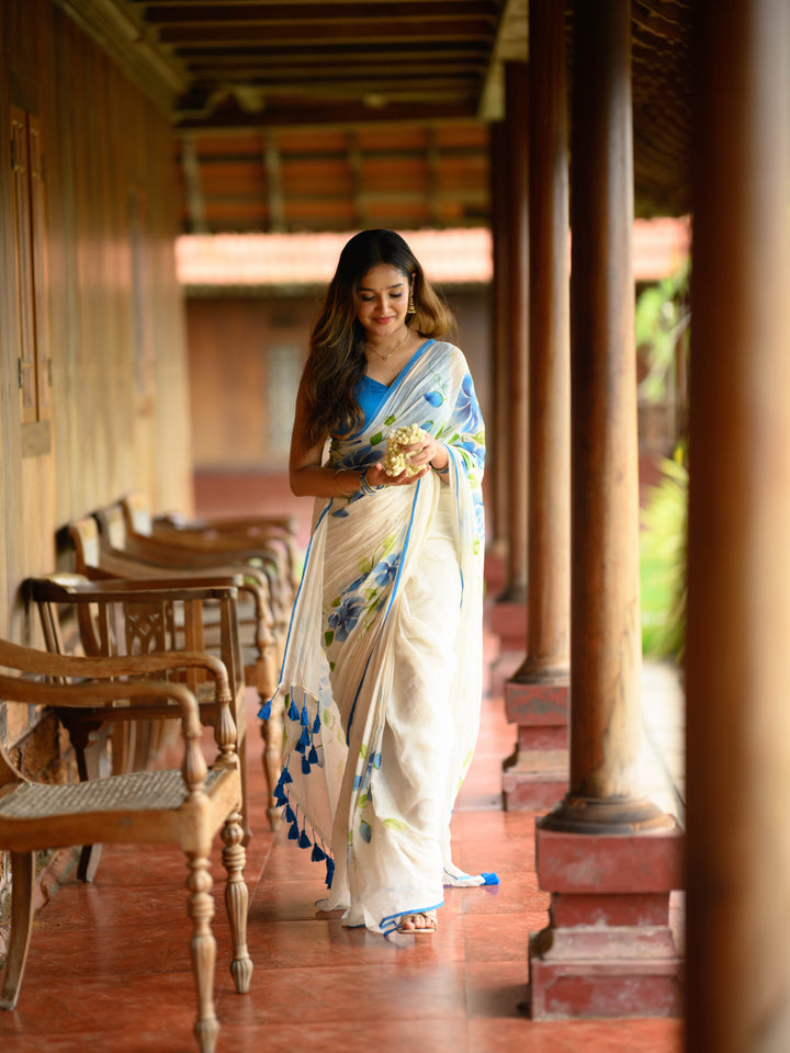 Ivory Chiffon Floral Printed Saree with Blue Rose Print, Contrast Border & Tassel Edges