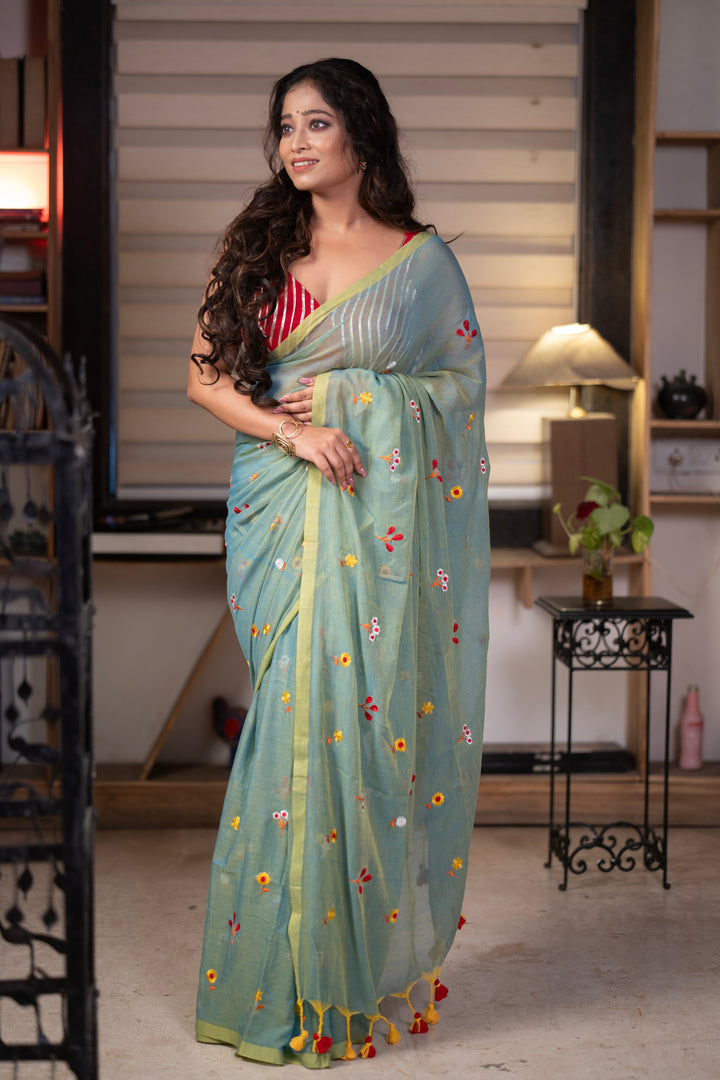 Sage Green Mul Cotton Saree with Multicolour Floral Motifs, Contrast Border & Tassel Pallu