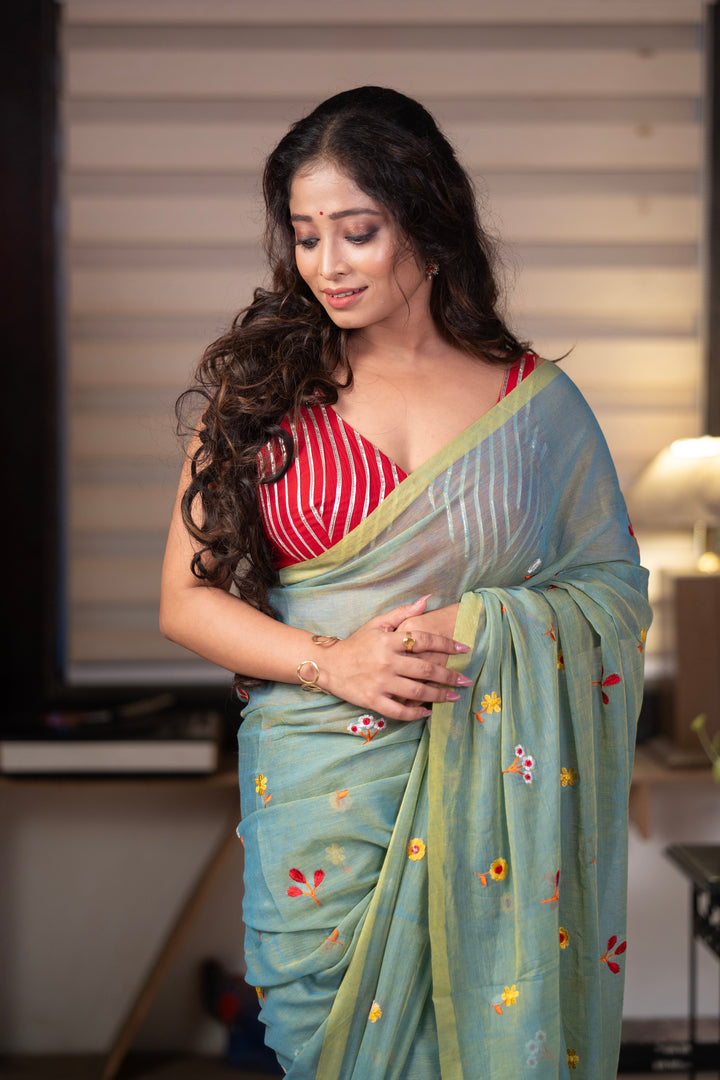 Sage Green Mul Cotton Saree with Multicolour Floral Motifs, Contrast Border & Tassel Pallu