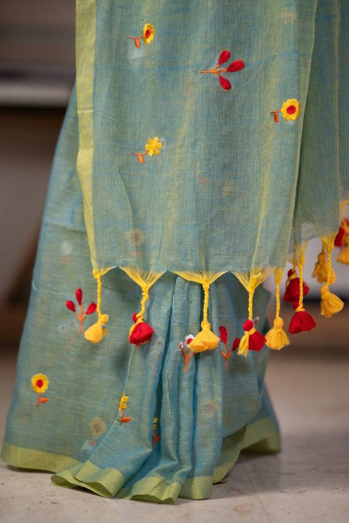Sage Green Mul Cotton Saree with Multicolour Floral Motifs, Contrast Border & Tassel Pallu