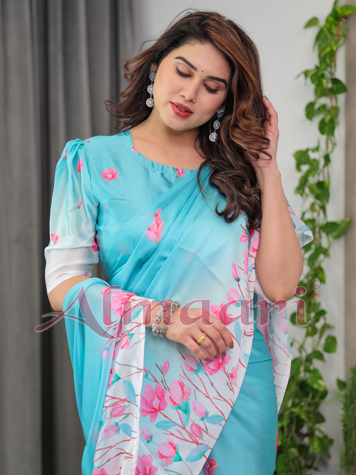 Aqua Blue Satin Georgette Pink Floral Printed Saree with Attached Blouse – Soft Pastel Designer Saree for Elegant & Festive Wear