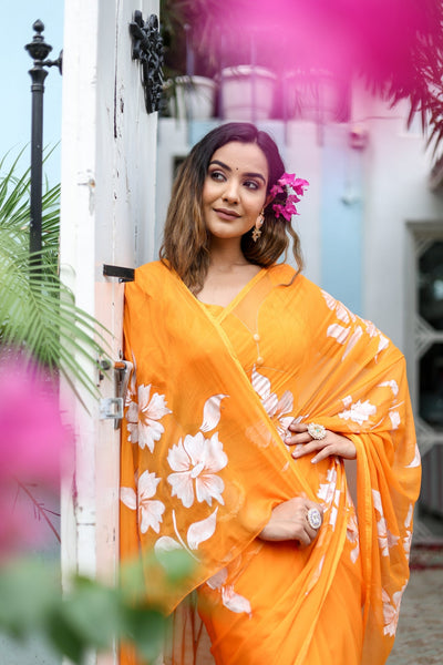 Sunset Orange Georgette Saree with Hand-Painted White Floral Motifs – Attached Blouse – 5.5 Meters