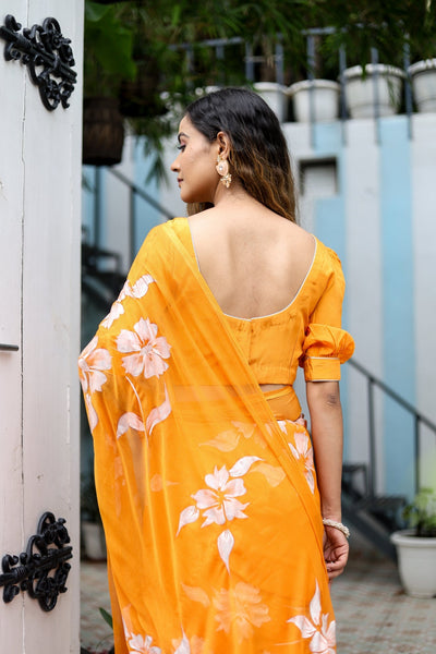 Sunset Orange Georgette Saree with Hand-Painted White Floral Motifs – Attached Blouse – 5.5 Meters