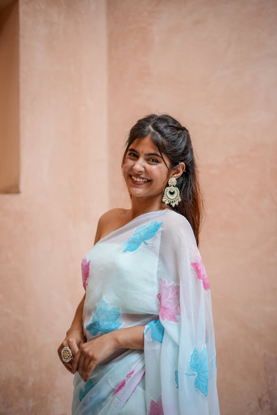 Sky Blue Georgette Saree with Embroidered Pink & Blue Leaf Motifs – Attached Blouse – 5.5 Meters