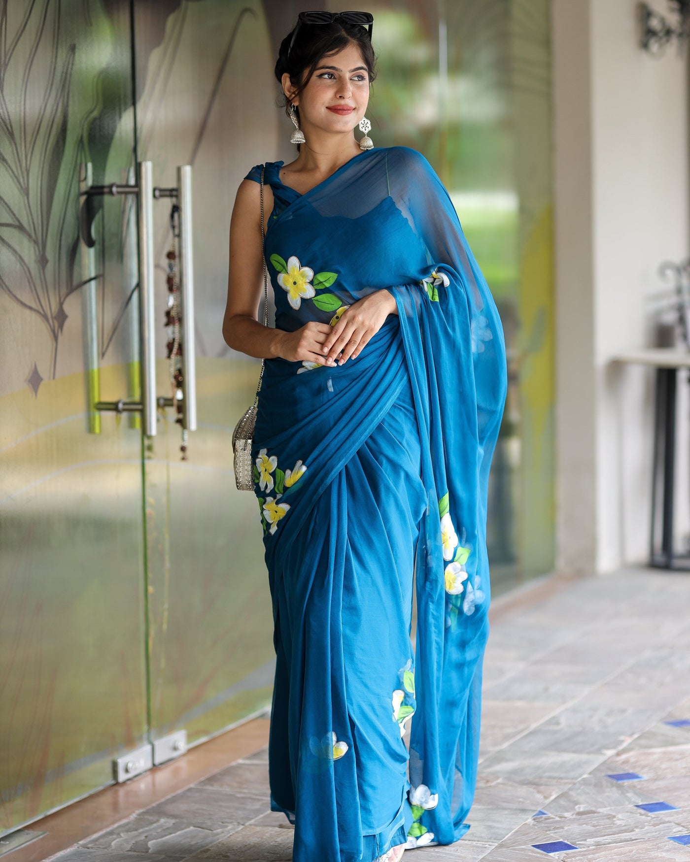 Teal Blue Georgette Saree with Hand-Painted Yellow & White Floral Motifs – Attached Blouse – 5.5 Meters
