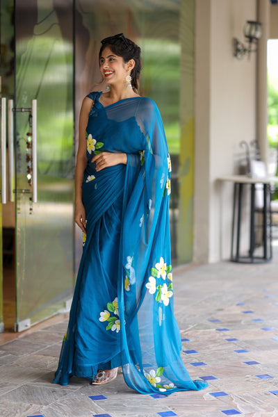 Teal Blue Georgette Saree with Hand-Painted Yellow & White Floral Motifs – Attached Blouse – 5.5 Meters