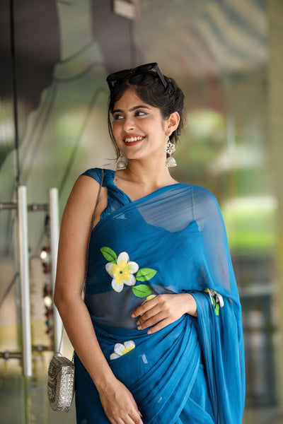 Teal Blue Georgette Saree with Hand-Painted Yellow & White Floral Motifs – Attached Blouse – 5.5 Meters