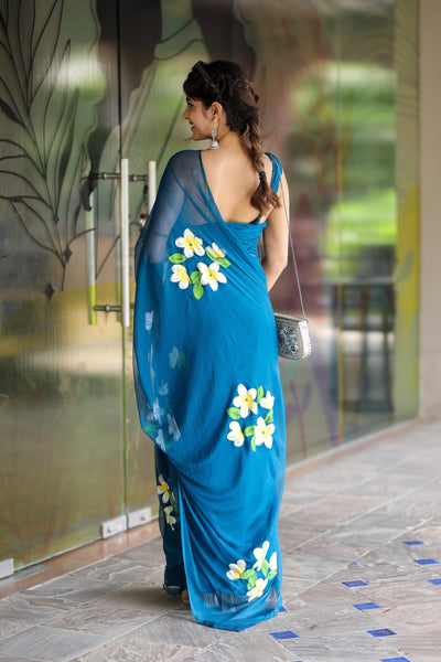 Teal Blue Georgette Saree with Hand-Painted Yellow & White Floral Motifs – Attached Blouse – 5.5 Meters