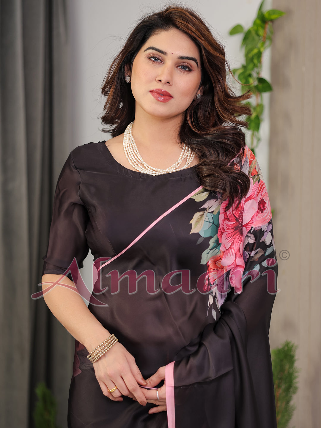 Black Satin Georgette Floral Printed Saree with Soft Pink Border & Attached Blouse – Elegant Designer Partywear Drape