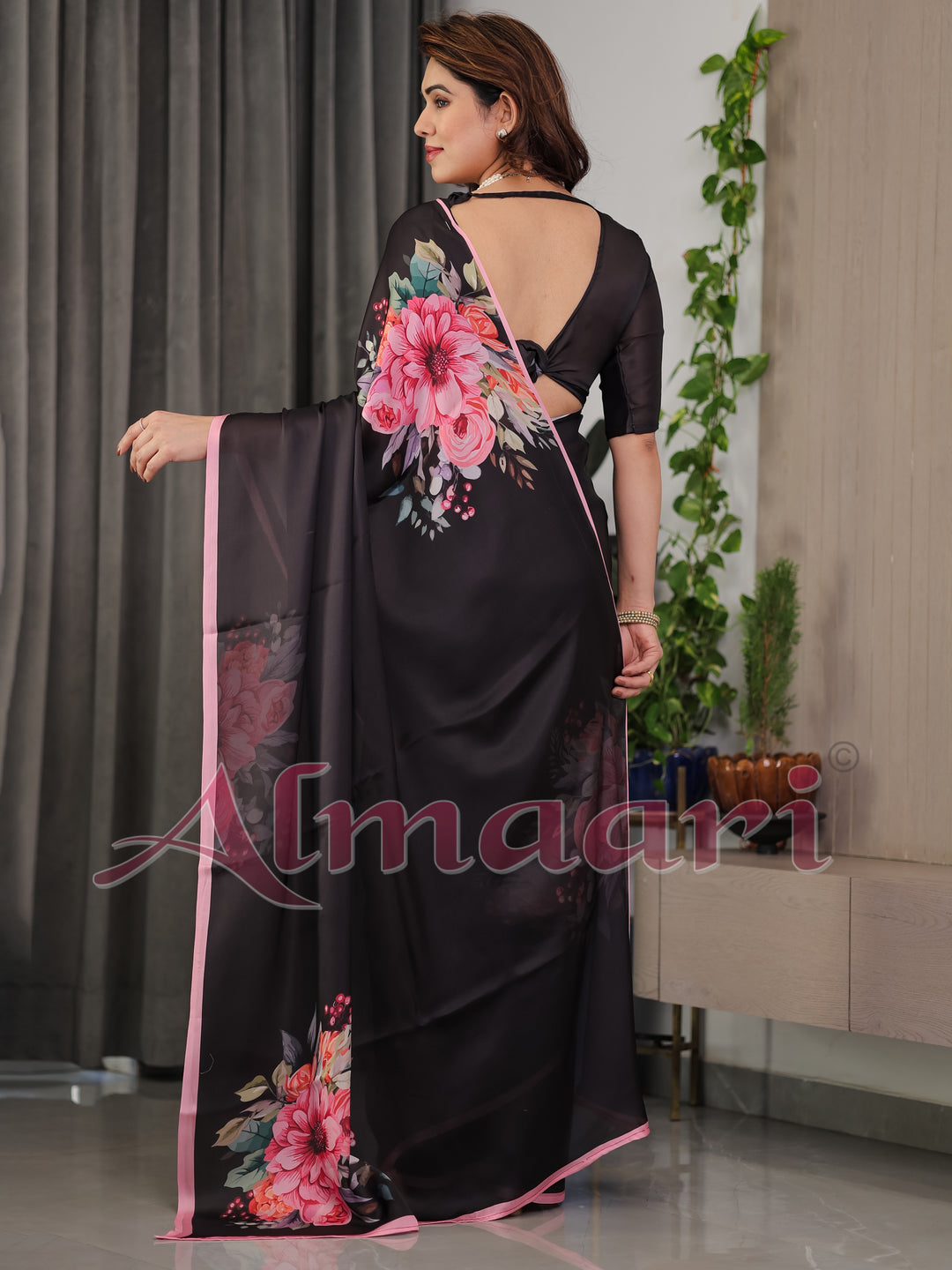 Black Satin Georgette Floral Printed Saree with Soft Pink Border & Attached Blouse – Elegant Designer Partywear Drape