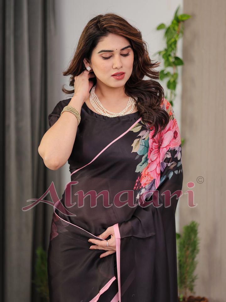 Black Satin Georgette Floral Printed Saree with Soft Pink Border & Attached Blouse – Elegant Designer Partywear Drape
