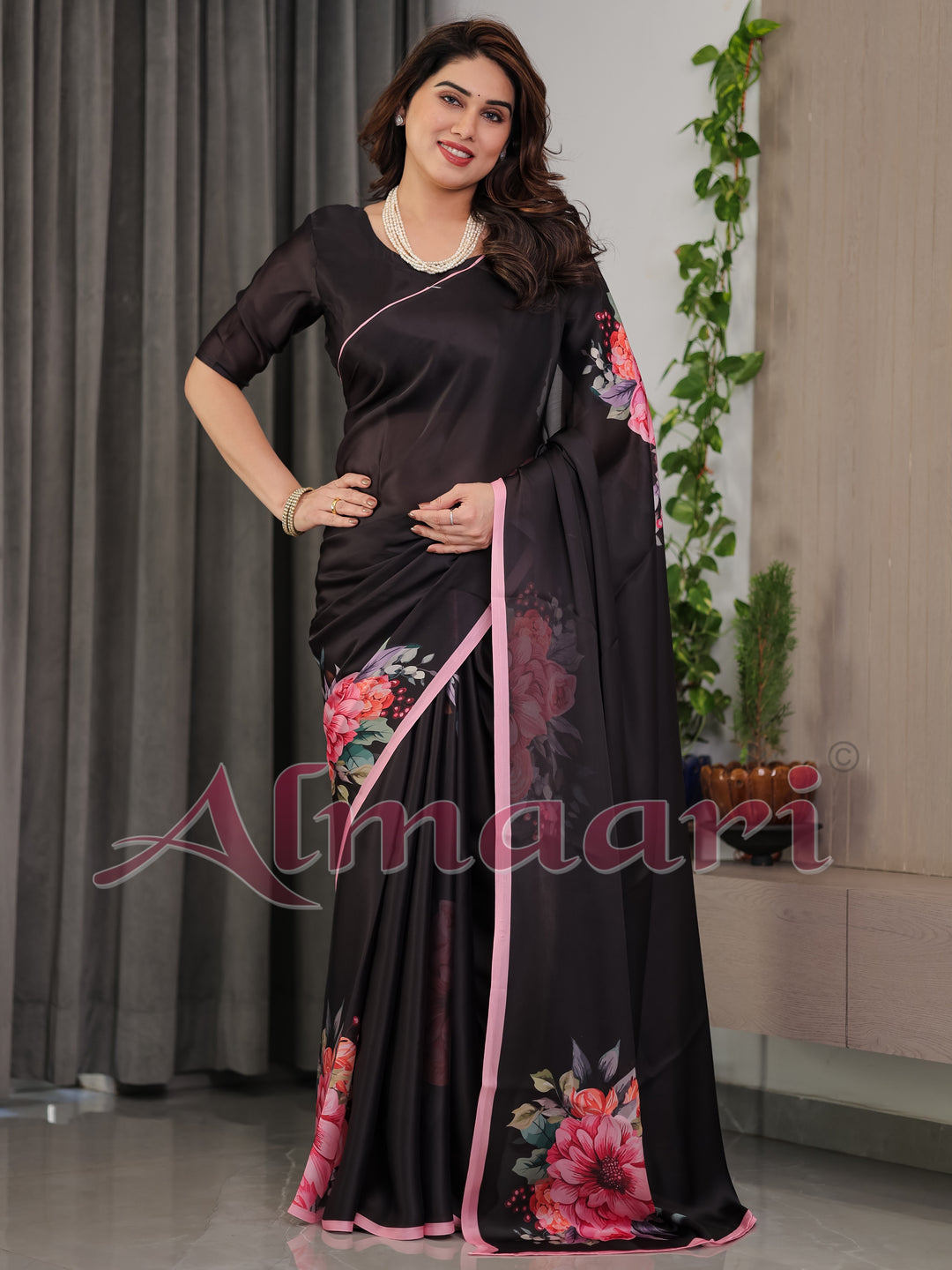 Black Satin Georgette Floral Printed Saree with Soft Pink Border & Attached Blouse – Elegant Designer Partywear Drape