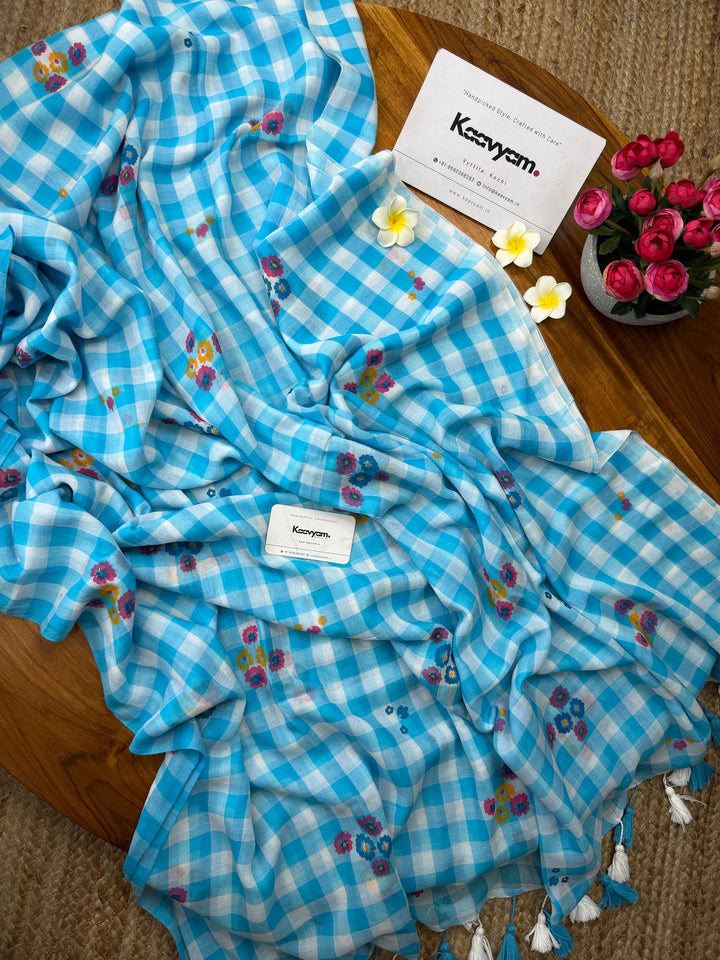 Sky Blue & White Checkered Mul Cotton Saree with Multicolour Floral Motifs, Tassels & Blouse Piece