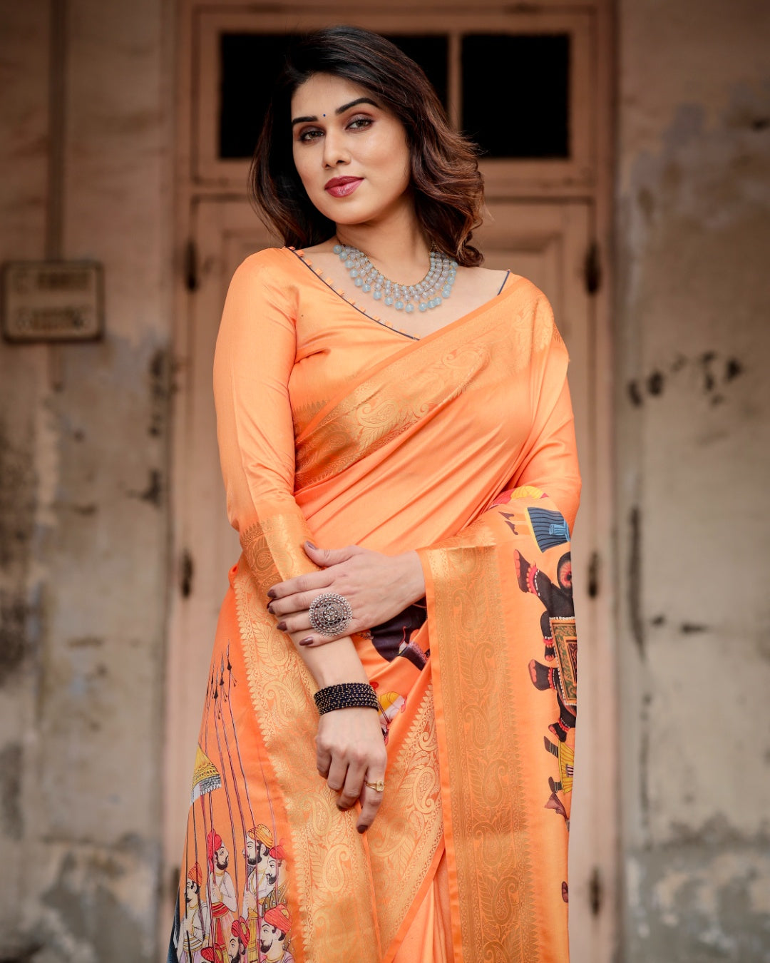 Vibrant Orange Tussar Silk Saree with Rajasthani Royal Procession Print, Zari Border & Tassels