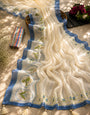 Ivory & Sky Blue Floral Printed Mul Cotton Saree with Botanical Border, Tassels & Attached Blouse