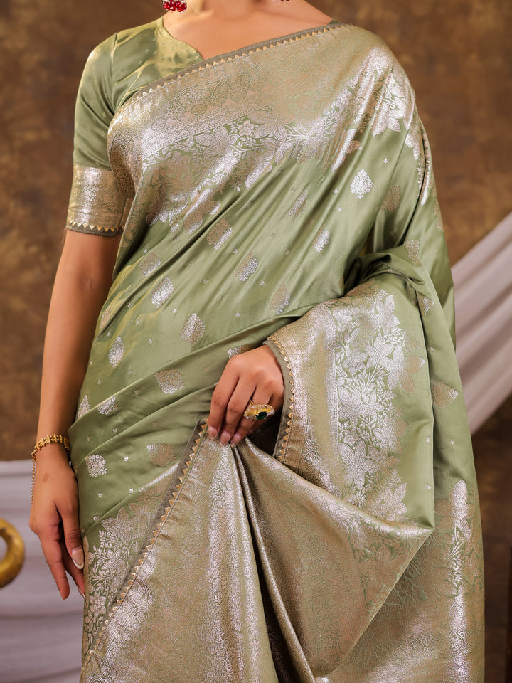 Sage Green Kanjivaram Banarasi Satin Silk Saree with Silver Zari Weaving, Floral Woven Border, Rich Designer Pallu & Tassels