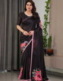 Black Satin Georgette Floral Printed Saree with Soft Pink Border & Attached Blouse – Elegant Designer Partywear Drape