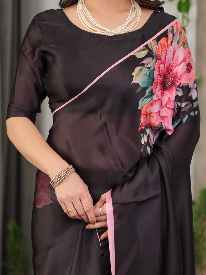 Black Satin Georgette Floral Printed Saree with Soft Pink Border & Attached Blouse – Elegant Designer Partywear Drape