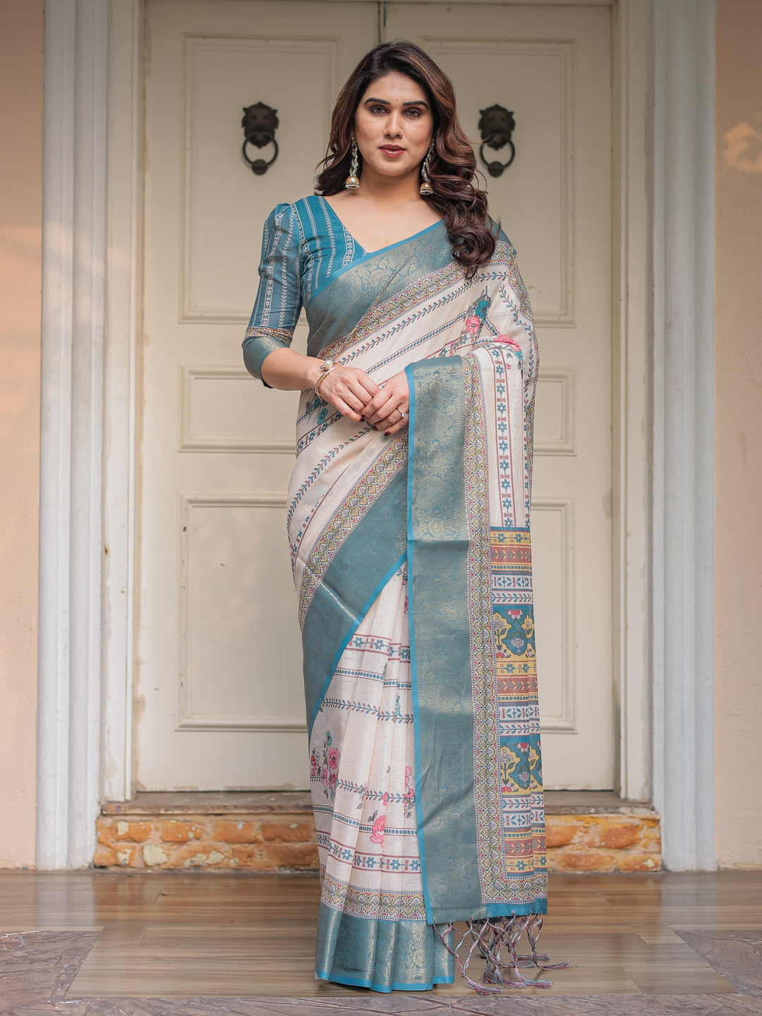 Off-White & Aqua Teal Traditional Printed Saree with Rich Zari Border & Tassels – Elegant Ethnic Festive Wear
